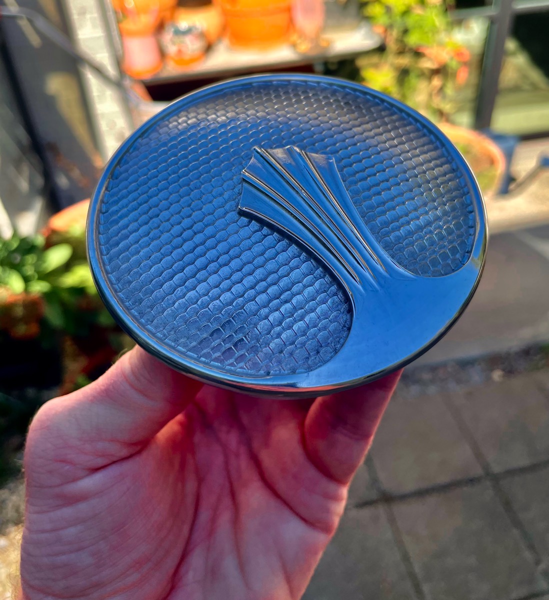 Machined replica of 1927 Nash radiator cap featuring scales and feather detail, produced by Hooper Machine & Desig