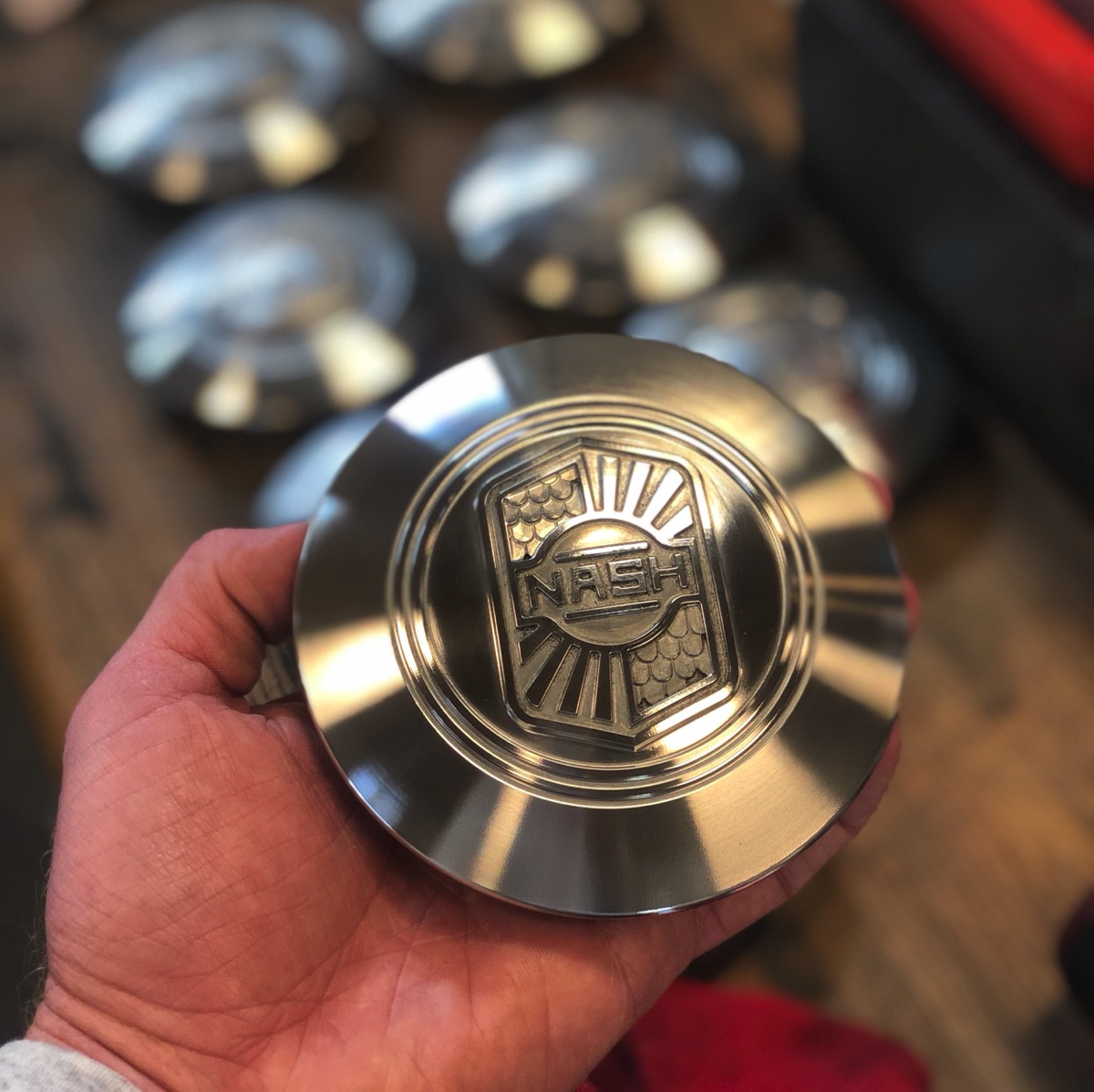 Detailed view of machined 1927 Nash hubcap centerpiece, reverse engineered from original part